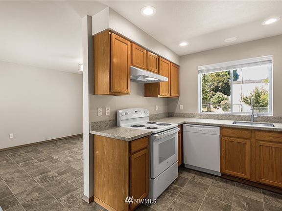 The kitchen provides easy and convenient access to the dining room. 