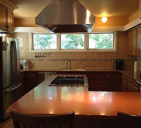 Beautiful custom kitchen with Corian countertops and lots of counter space