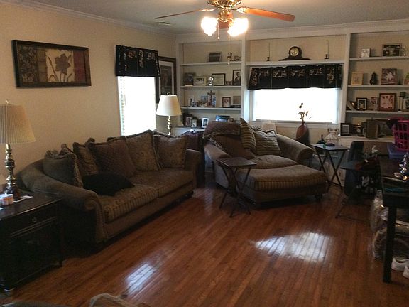Nice spacious living room with built in shelving