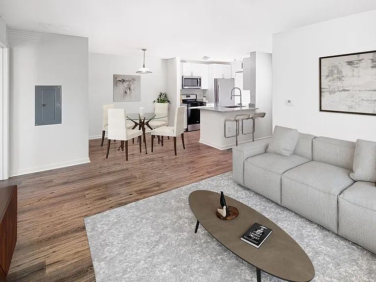 Phase I Renovated Package I apartment living and dining area with hard surface flooring