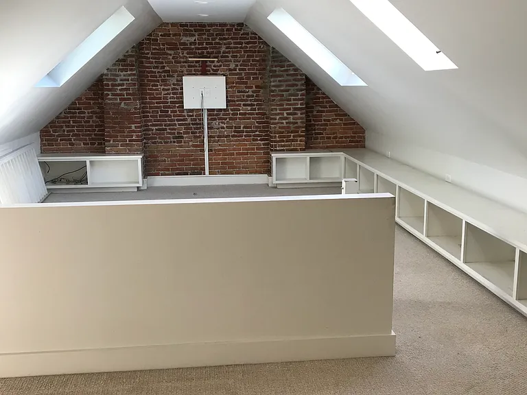 3rd floor with built-in cabinets and large skylights and TV hookup