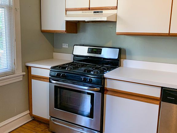 Large eat-in kitchen with updated stainless steel appliances.