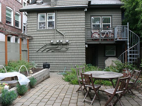 Back Courtyard with patio furniture and garden boxes