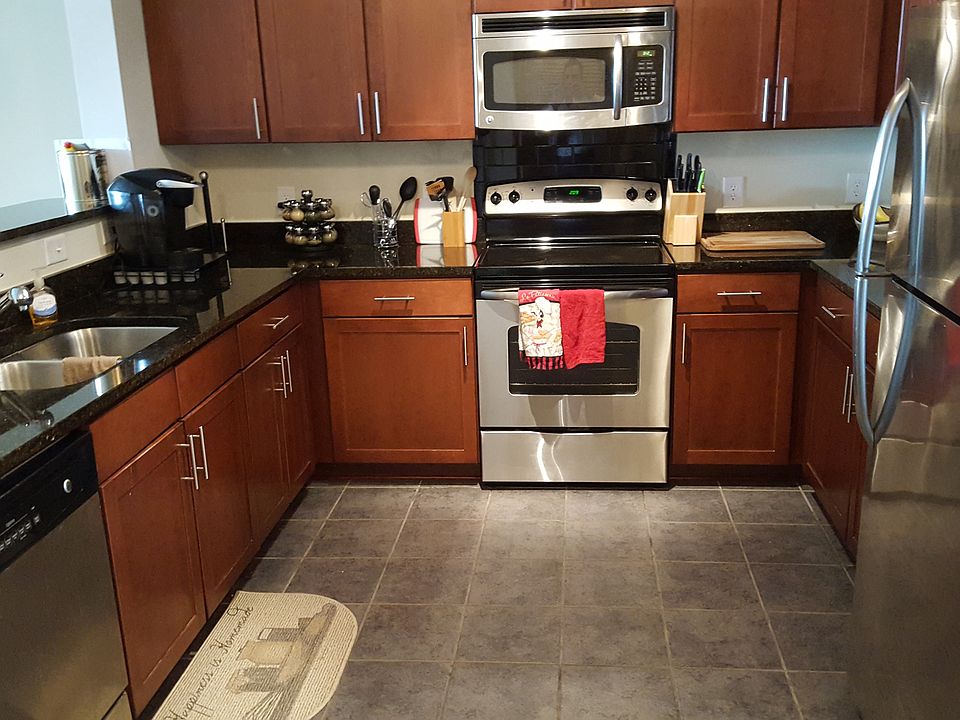 Granite Kitchen, Stainless Steel appliances and marble floor