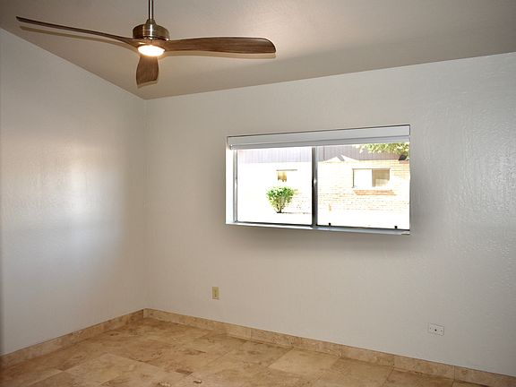 Master Bedroom has a modern ceiling fan and blackout roller window shade installed Aug 2024. There is also an ensuite Bathroom and linen closet