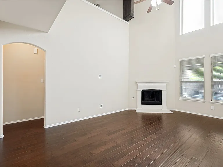 High ceilings in the living area with a fireplace