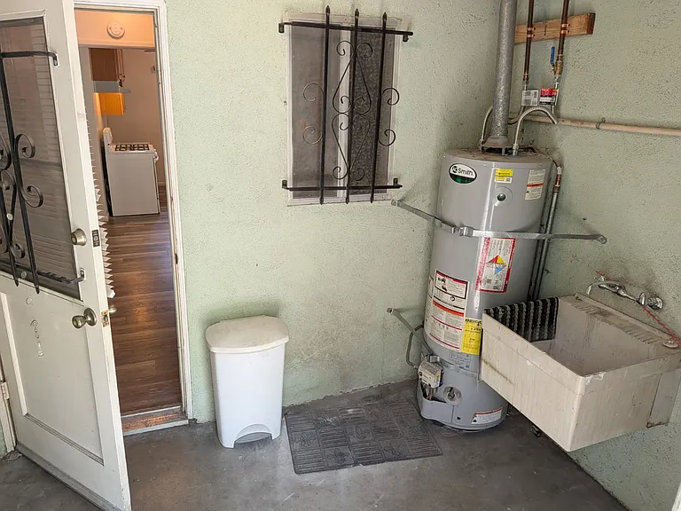 private laundry room with sink