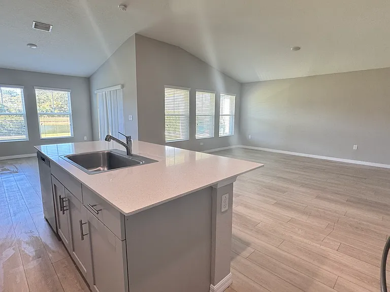 Open concept kitchen, dining room and living room .