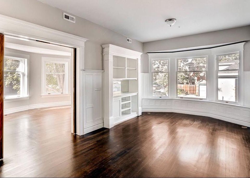 Family room with master bedroom to the left. Shown vacant