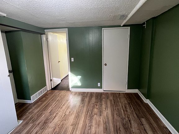 Photos don't show the bedroom well- this bedroom comfortably fits a king bed with side tables, there are 2 closets and lots of morning light!
