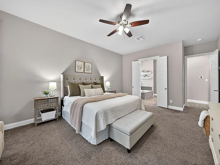 Master bedroom large enough for king size bed, dresser, TV, couch, and nightstands.