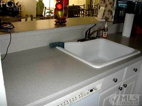 Hard surface counter tops, new sink & faucet.