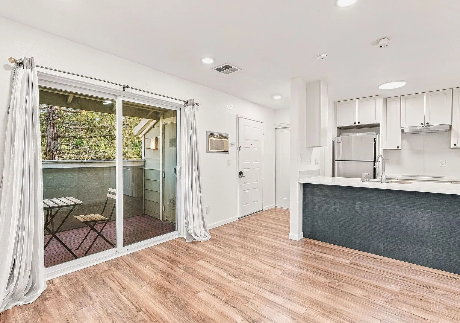 Updated 1-Bedroom Condo with Private Balcony and Garage — Photo 4