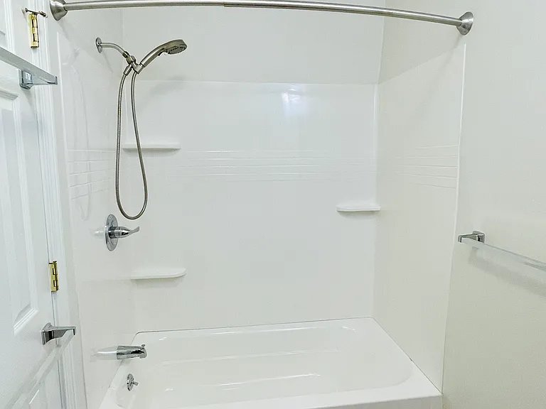 Brand new tub and shower surround, clean and fresh!