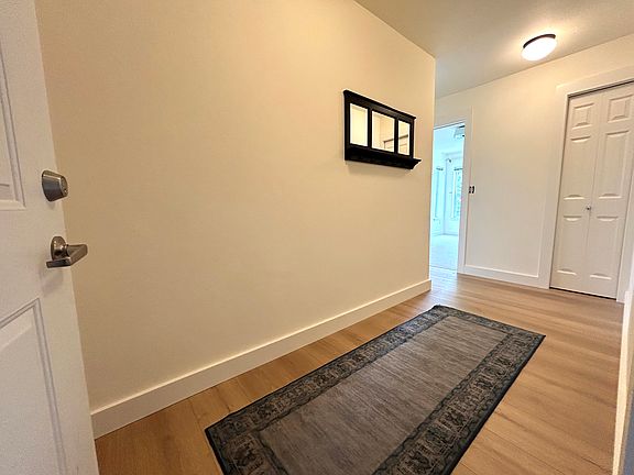 Long spacious hallway to keep shoes, jackets, bags out of sight.