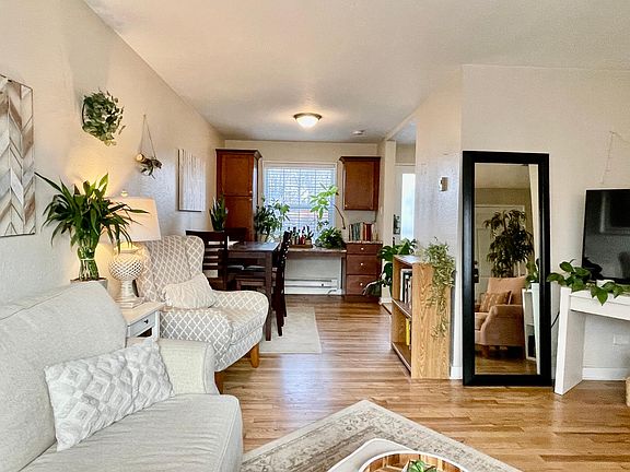 Living room and dining room area with large pantry