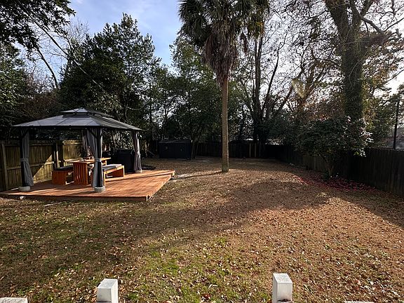 Private Backyard feature a brand new deck and storage area.