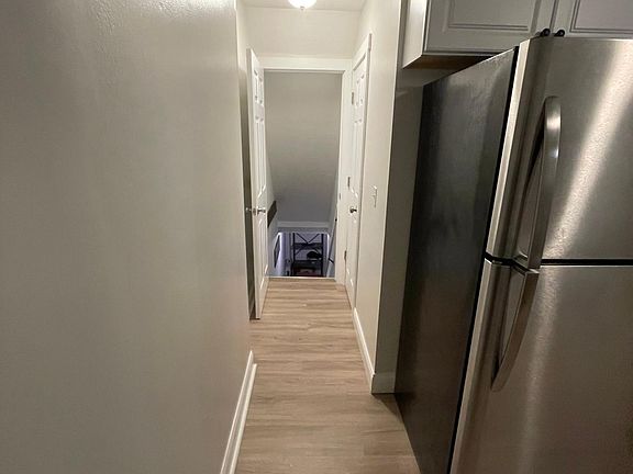 Hallway to basement/half bath