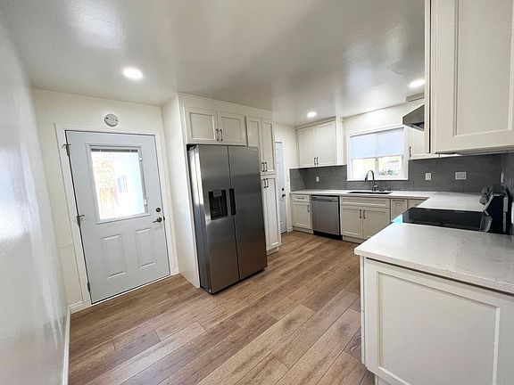 New floor, New Kitchen cabinets, New countertop, New backslash