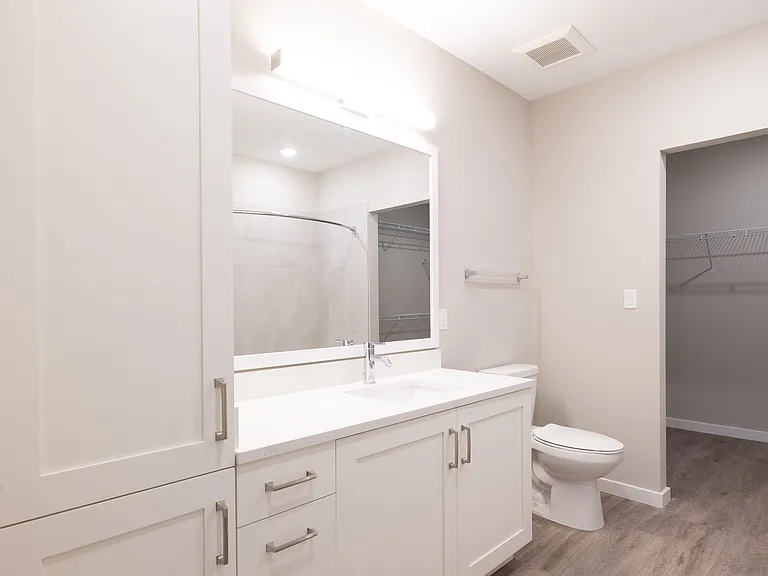 Imperial Crossing Luxury Apartment Homes unit showing a bathroom with storage cabinet.