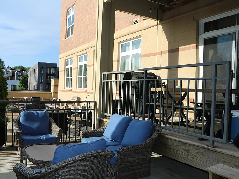 Cozy seating, grill, and gorgeous river views _ your go-to spot all summer long