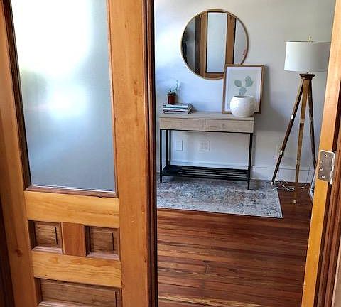 Restored pine and walnut double doors to the apartment, view from house vestibule.