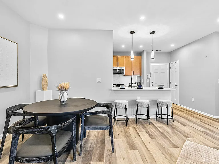 Experience modern living with this chic dining area and kitchen, perfect for entertaining.