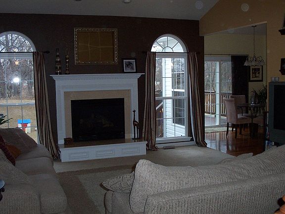 Great Room w/vaulted ceiling and marble fireplace