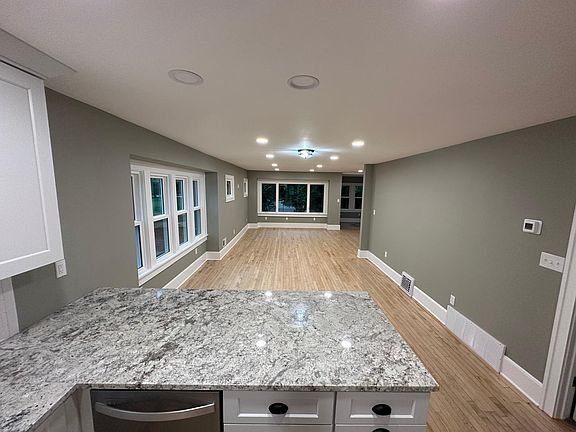 Open concept Living, Dining, Kitchen with many windows for natural lighting