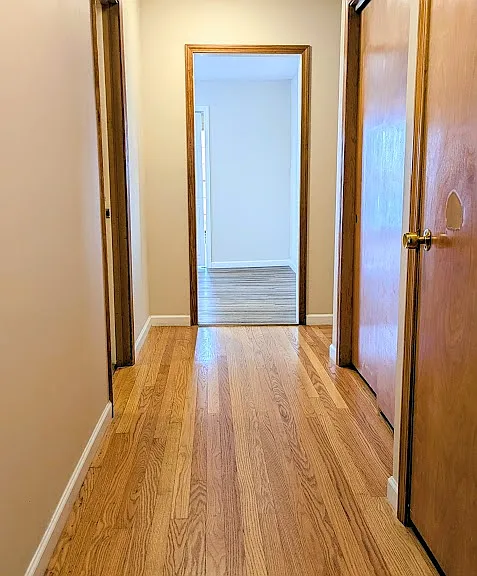 Hallway by the third bedroom, bonus and laundry rooms.
