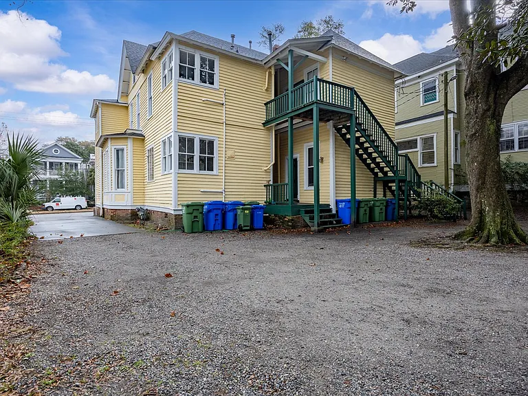 Parking space behind house, apartment upstairs on right