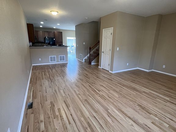 Open floor plan on the main level. New hardwood floors