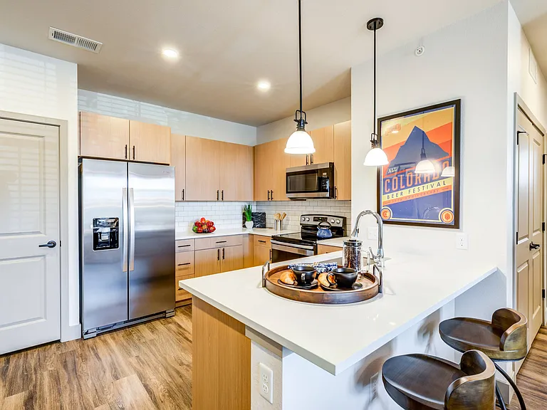 Stone countertops and modern subway tile backsplash