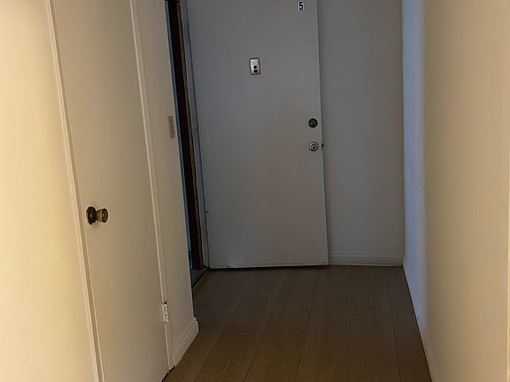 hallway with a closet upon entrance to enter