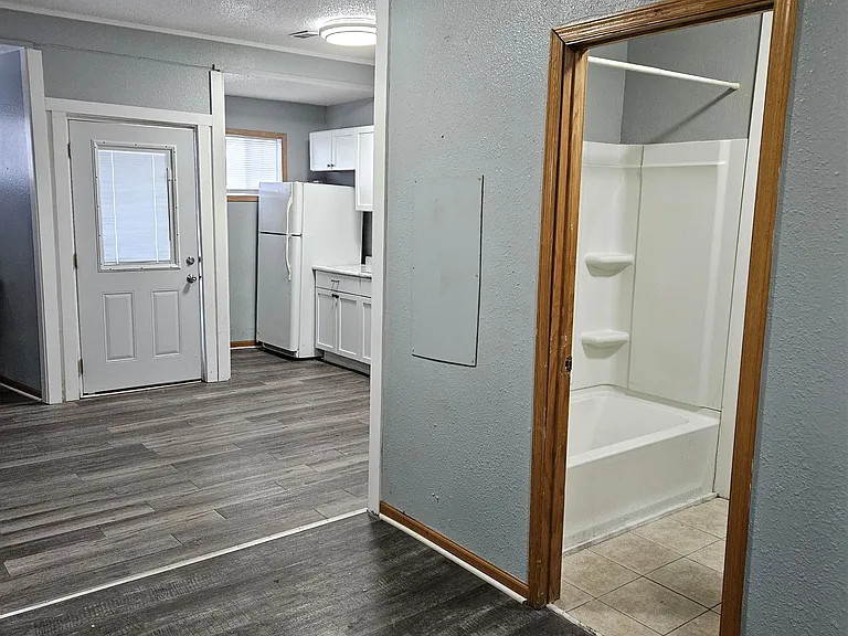 from bedroom door to entry, on the side bathroom door.