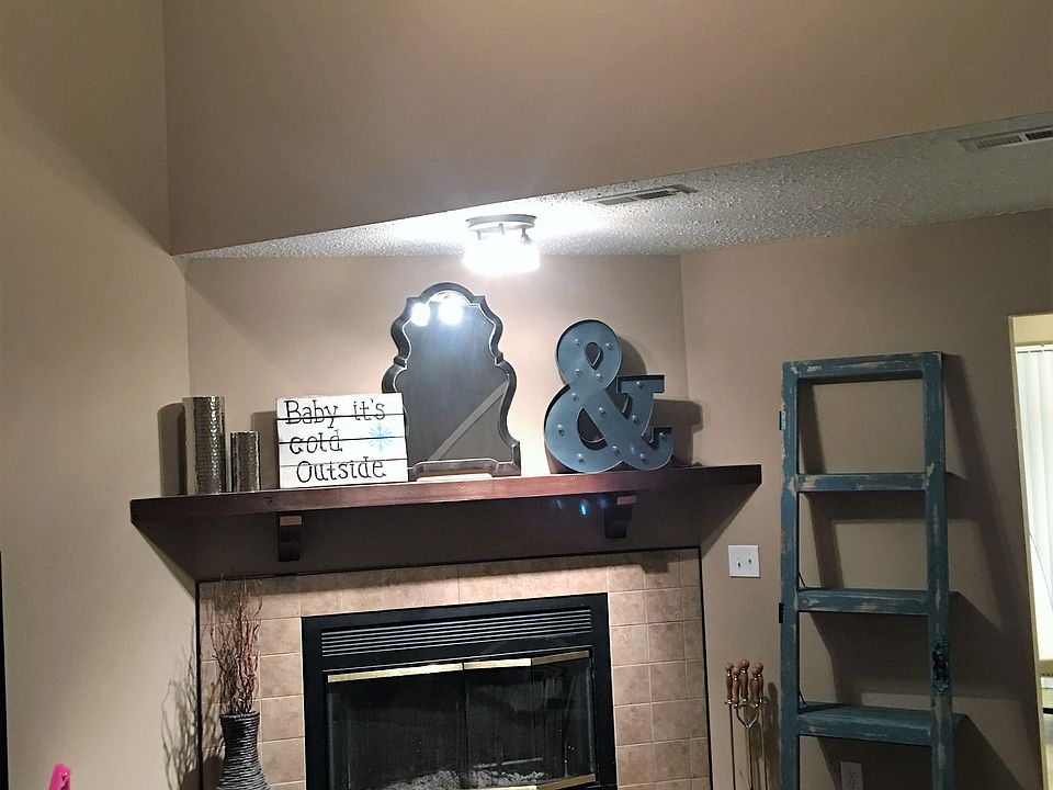 living room valuted ceiling with fireplace