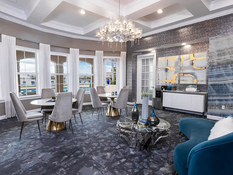 Step into our leasing office, relax in the cozy lounge area, and take in the stunning pool and lake views.