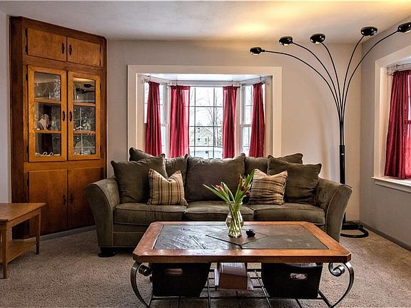 This cape style home has several lovely built in cabinets.  Look at the natural light!