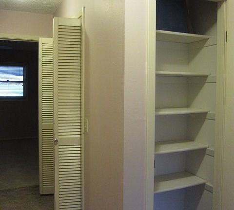 llway with closet and launrdry