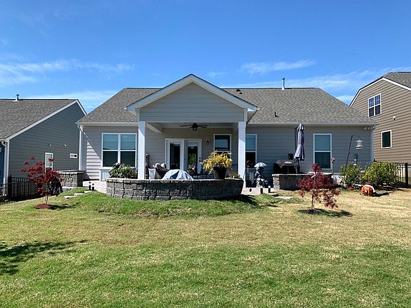 Fenced in back yard with covered patio
