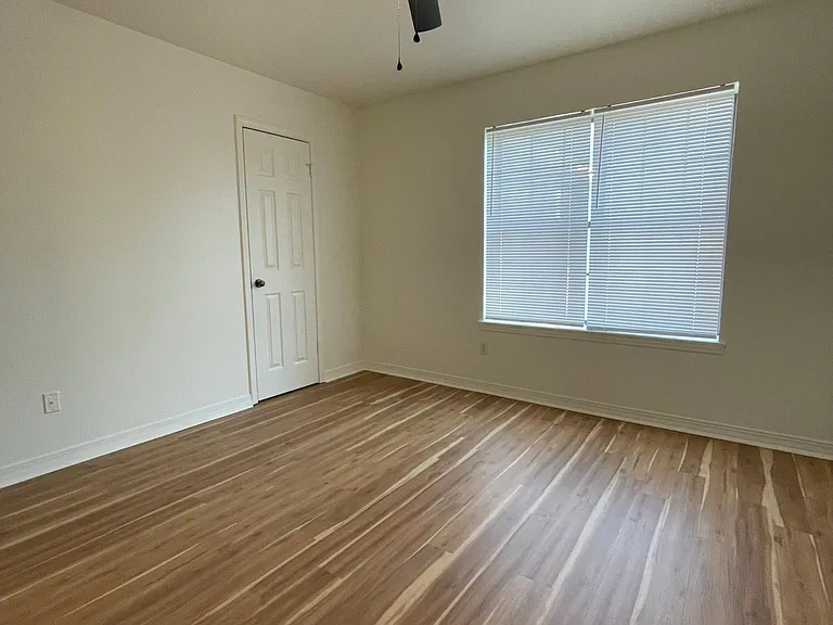 Bedroom, walk in closet, new flooring and new fan/ lighting & blinds