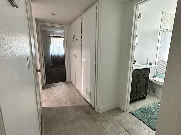 Hallway between bedrooms with the guest/hall bath in between each bedroom