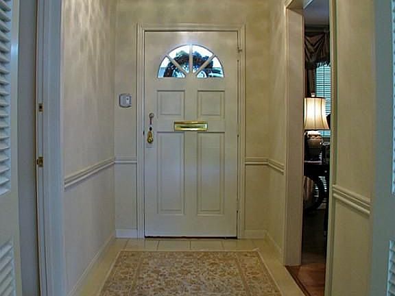 An elegant entry foyer is the perfect place to meet guests. This home loves a good party!