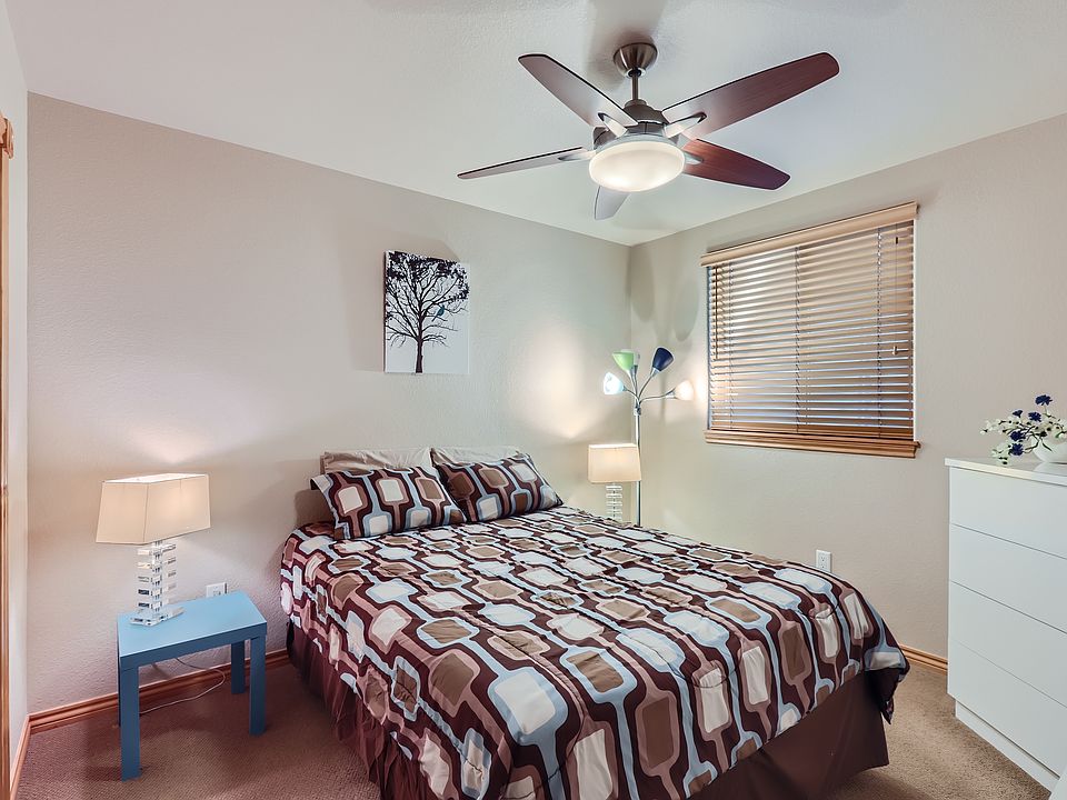 Lower Level Suite with queen bed, 2 night stands and two dressers.