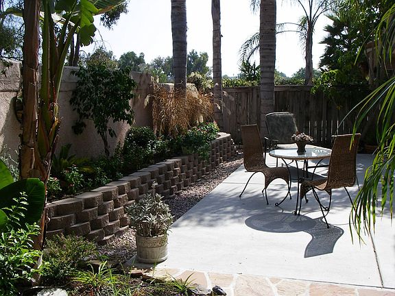 Lush Tropical Backyard Patio, Swing, Pond, Shed 