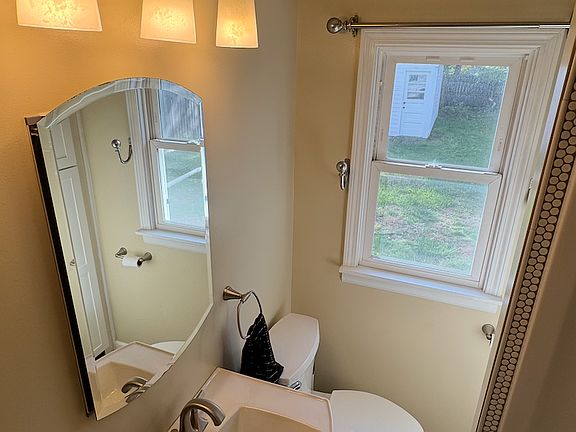 Bathroom, including medicine cabinet and two linen closets for storage