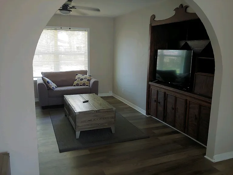 Living room furnished opposite view