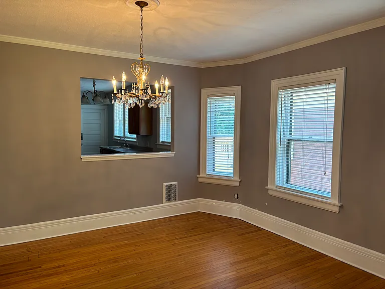 Family room currently used as the dining room. Chandelier can be switched out with lighting in dining room.