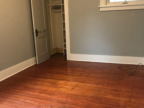 Bedroom natural hardwood floors walk in closet