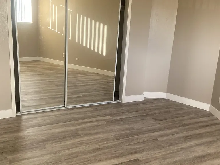 Enjoy sliding mirrored closet doors and an extra-long wall-to-wall closet that offers generous storage in the bedroom.